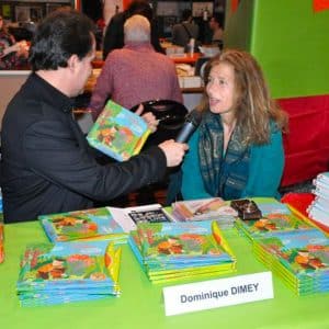 Dominique Dimey dédicace de son livre CD Le jardin d'Albert au salon du livre jeunesse